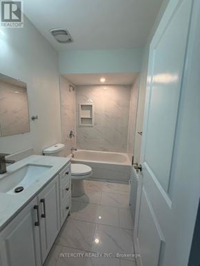 Toronto (Annex) house for rent - A bathroom with a tub, toilet, and sink.