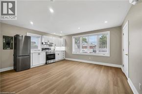 Hamilton apartment for rent - A well-lit kitchen with wooden floors and modern appliances.