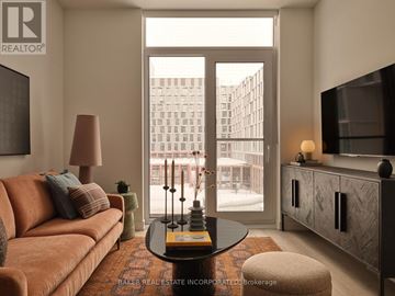 Toronto (Waterfront Communities) condo for rent - A modern living room with green chairs and a coffee table.
