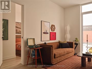Toronto (Waterfront Communities) condo for rent - A modern living room with green chairs and a coffee table.