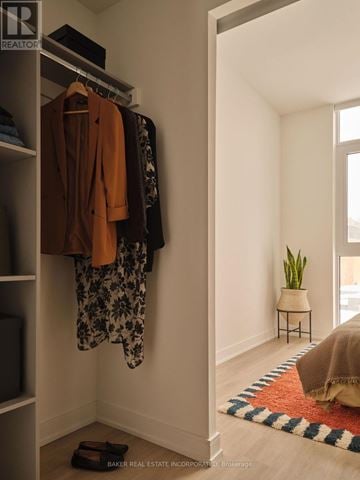 Toronto (Waterfront Communities) condo for rent - A modern living room with green chairs and a coffee table.