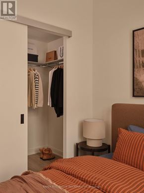 Toronto (Waterfront Communities) condo for rent - A spacious room with yoga mats and a pillar in the middle.