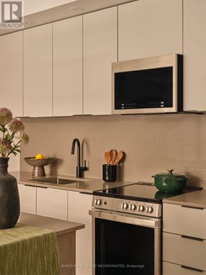 Toronto (Waterfront Communities) condo for rent - A floor plan of a home with a living room, two bedrooms, a kitchen, and a dining area.