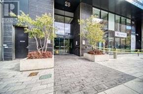 Toronto (Church-Yonge Corridor) condo for rent - The image shows a building entrance with a glass door and a sign that reads "REALTOR".