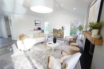 Auburn Hills apartment for rent - A living room with a white couch and a coffee table.