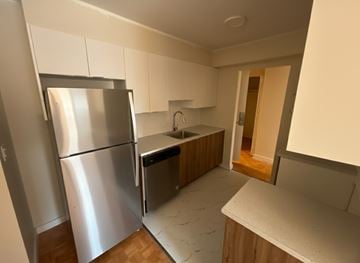 Dartmouth apartment for rent - A kitchen with a refrigerator, sink, and countertop.