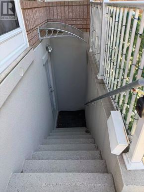 Richmond Hill (Rouge Woods) house for rent - A stairway leading down to a basement with a white railing.