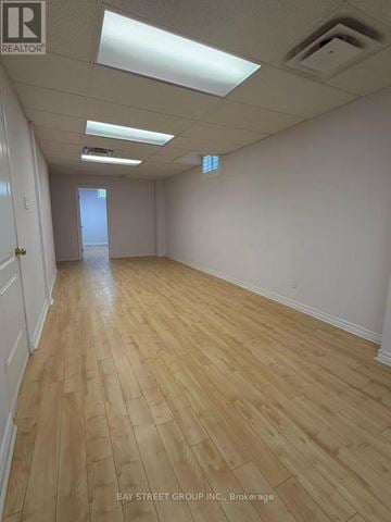 Richmond Hill (Rouge Woods) house for rent - A dining room with a table set for two and a vase of flowers on the table.