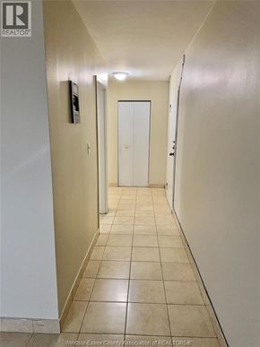 Windsor apartment for rent - A hallway with a door at the end.