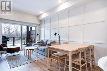 Blue Mountains condo for rent - A well-lit, modern living room with a dining table and chairs.