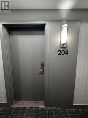 Toronto (Beechborough-Greenbrook) condo for rent - An elevator with the number 204 on the wall.