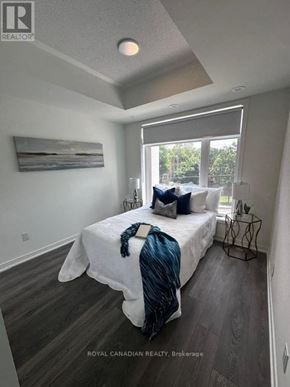 Toronto (Beechborough-Greenbrook) condo for rent - A bedroom with a bed, pillows, and a window.