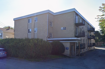 Halifax apartment for rent - Apartment building with a car parked in front.