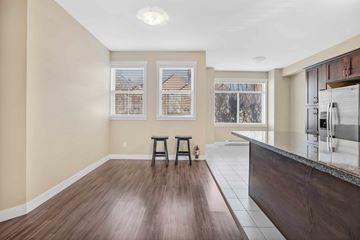 Surrey apartment for rent - A kitchen with a bar stool and a counter.