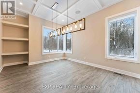 Ottawa house for rent - A well-lit room with a large window and a wooden floor.