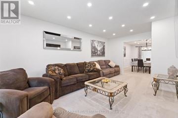 For rent in London North (North A) - A living room with a brown couch and a coffee table.
