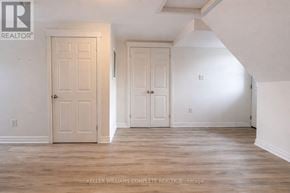 Hamilton (Stinson) house for rent - A room with two doors and a brokerage sign.