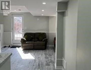 Brampton (Northwest Brampton) house for rent - A living room with a couch and a window.