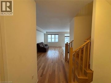 Thorold townhouse for rent - A living room with a couch and a window.