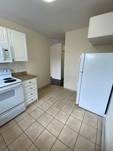 Halifax apartment for rent - A kitchen with a white refrigerator and a white stove.