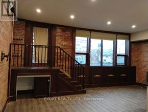 Belleville (Belleville Ward) house for rent - A room with a staircase and brick walls.
