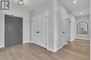 Wellington North (Mount Forest) multi-family for rent - A room with a white door and a black door.