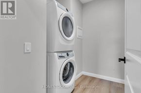 Wellington North (Mount Forest) multi-family for rent - A white washer and dryer in a laundry room.