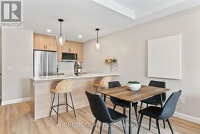 Brockton multi-family for rent - A modern kitchen with a dining table set up.