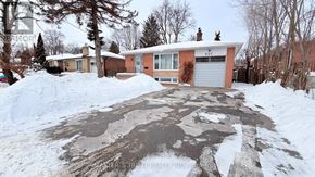 Richmond Hill (Crosby) house for rent - A house with a driveway covered in snow.