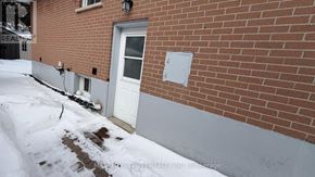 Richmond Hill (Crosby) house for rent - A red brick house with a white door and a sign that says "REALTY INC."