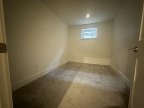 Surrey house for rent - A room with a window and carpeted floor.