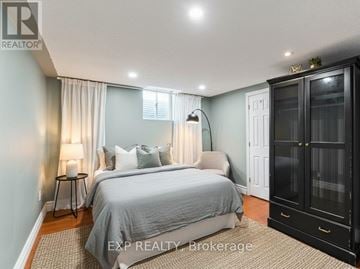 Ajax (Central West) house for rent - A bedroom with a large bed and a cabinet.