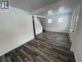 Windsor house for rent - A room with wooden flooring and white walls.