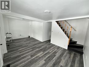 Windsor house for rent - A room with wooden flooring and a staircase.