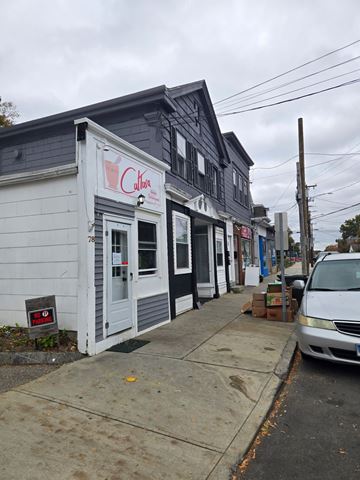New London apartment for rent - A white building with a red sign that says "Calabasas" on it.