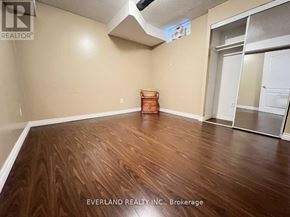 Markham (Cedarwood) house for rent - A room with wooden flooring and a white door.