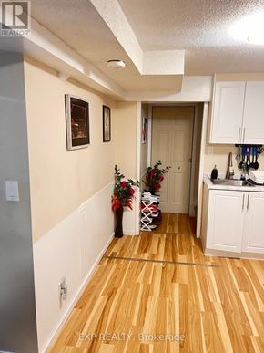 Ajax (Central West) house for rent - A hallway with a Christmas tree and vase on the floor.