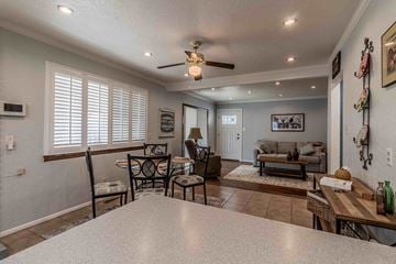 Farmington apartment for rent - A living room with a dining table and chairs.