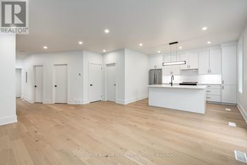 Hamilton (Ancaster) other for rent - A living room with a white couch and a coffee table.