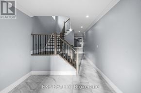 Bradford West Gwillimbury (Bradford) house for rent - A spacious hallway with a staircase leading to the upper level.