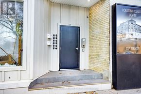 St. Thomas multi-family for rent - A door with a black handle and a sign on the wall.