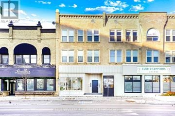St. Thomas multi-family for rent - A building with a Club Champions sign on the front.