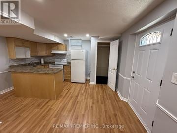 Vaughan (Elder Mills) house for rent - A kitchen with wooden floors and white appliances.