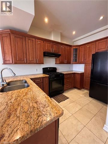 Hamilton apartment for rent - A living room with a grey couch and a wooden coffee table.