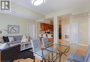 Hamilton apartment for rent - A living room with a glass table and chairs.