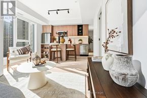 Ottawa condo for rent - A modern living room with a white couch and a wooden coffee table.