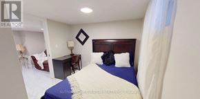 Hamilton (Centremount) house for rent - A bedroom with a bed, desk, and chair.