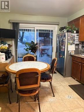 Toronto (West Hill) house for rent - A kitchen with a table and chairs in front of a window.