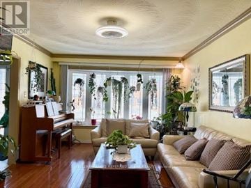 Toronto (West Hill) house for rent - A living room with a brown couch and a piano.