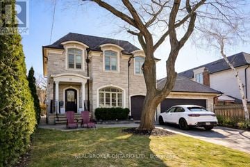 Toronto (Kingsway South) other for rent - A modern kitchen with wooden cabinets and stainless steel appliances.